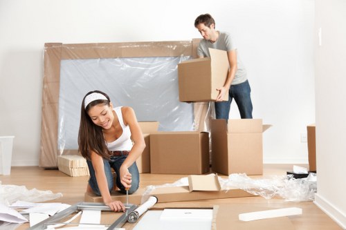 Flat removals team planning a move in Clapham with boxes and furniture