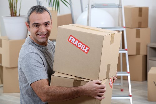 Local movers handling furniture in a Clapham flat