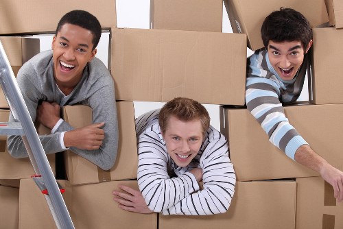 Local moving team loading furniture for a house move in south London