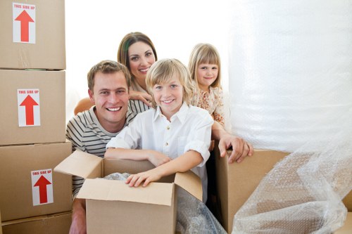 Professional movers preparing fragile belongings for transport in Clapham
